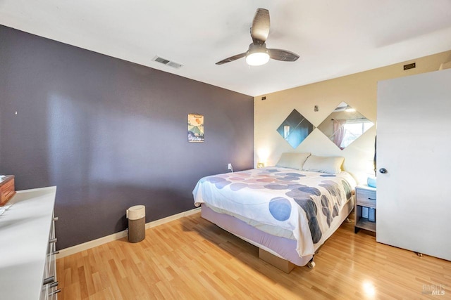 bedroom with hardwood / wood-style flooring and ceiling fan