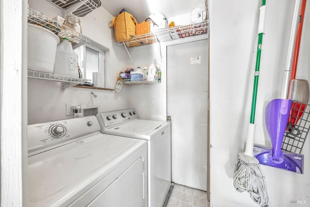 clothes washing area featuring independent washer and dryer