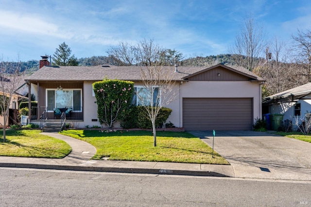 single story home featuring a garage and a front yard