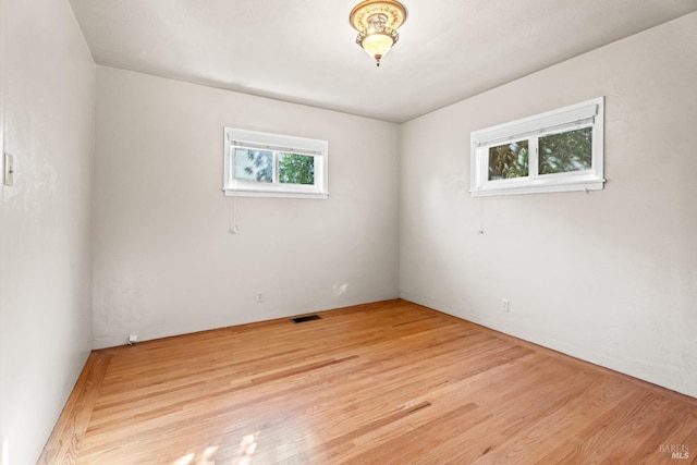 spare room with light wood-type flooring