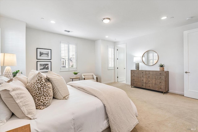 bedroom with recessed lighting, light carpet, visible vents, and baseboards