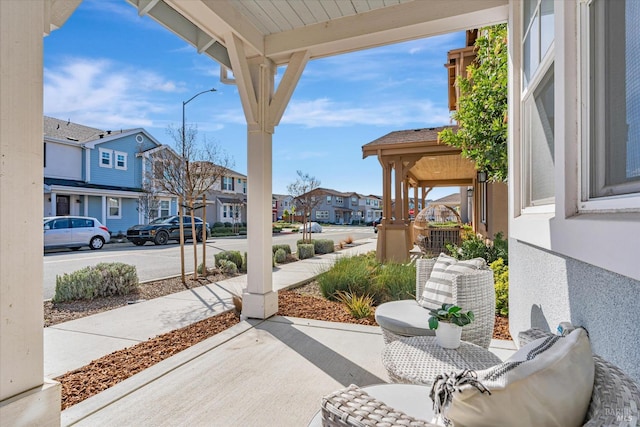 view of patio with a porch and a residential view