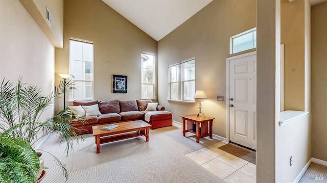 tiled living room with high vaulted ceiling