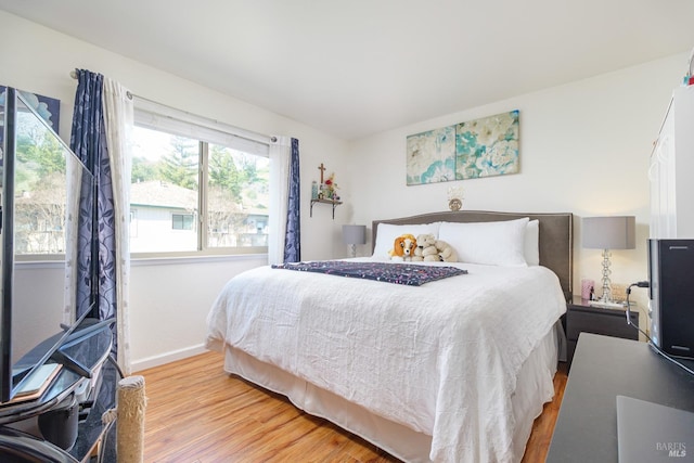 bedroom with light wood-type flooring