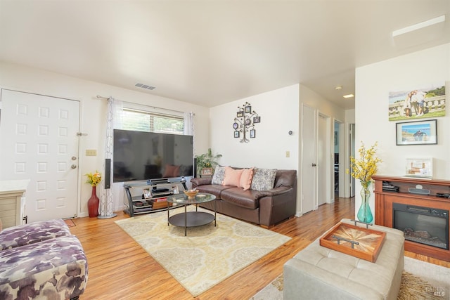 living room with light hardwood / wood-style flooring