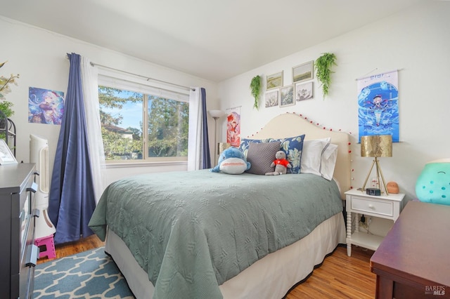 bedroom featuring hardwood / wood-style flooring