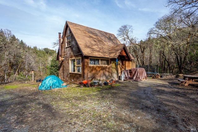 view of property exterior with a trampoline