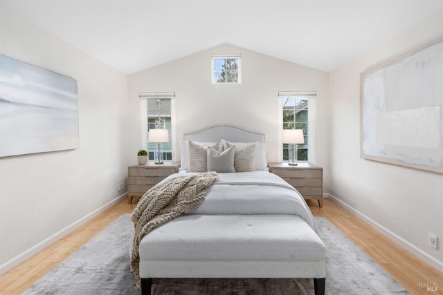 bedroom featuring wood-type flooring and lofted ceiling