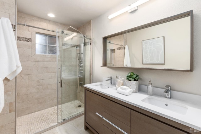 bathroom with vanity and an enclosed shower