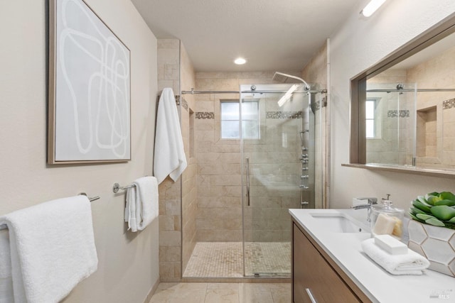 bathroom with vanity and walk in shower