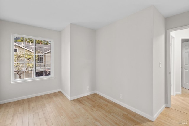 spare room featuring light wood-type flooring