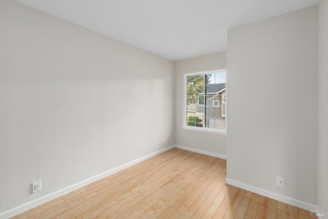 unfurnished room featuring light wood-type flooring