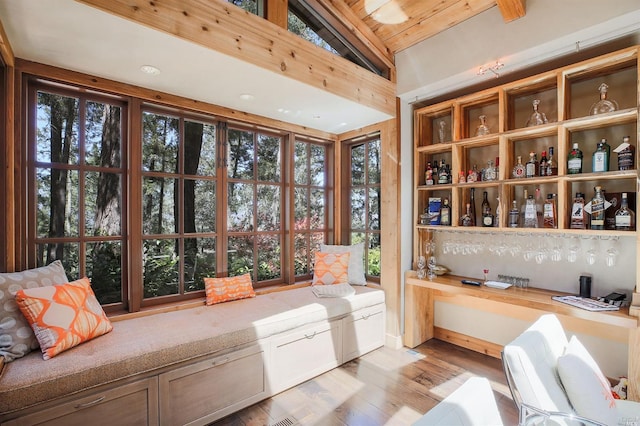 interior space with vaulted ceiling and built in desk