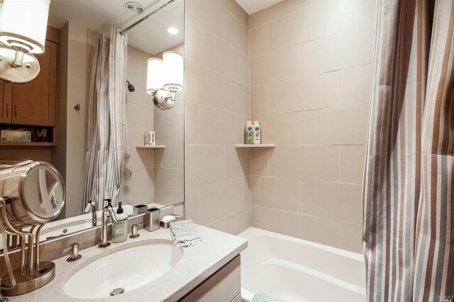 bathroom with vanity and shower / bath combo