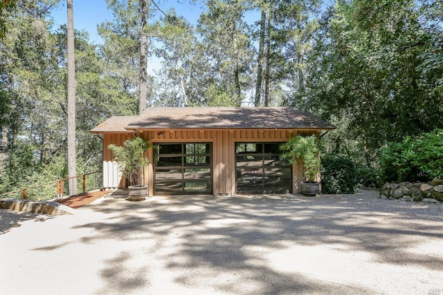 view of home's community featuring an outbuilding