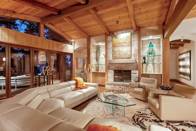 living room with a stone fireplace, wooden ceiling, built in features, beam ceiling, and hardwood / wood-style floors