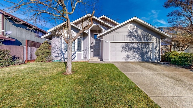 view of front of property with a garage and a front lawn