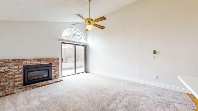 unfurnished living room featuring high vaulted ceiling, a fireplace, ceiling fan, light carpet, and a textured ceiling