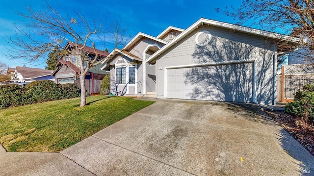 view of front of house featuring a garage and a front yard