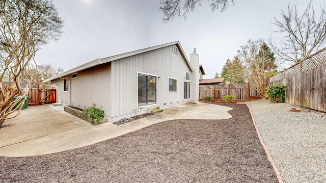 back of house with a patio