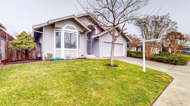 view of front facade with a garage and a front yard