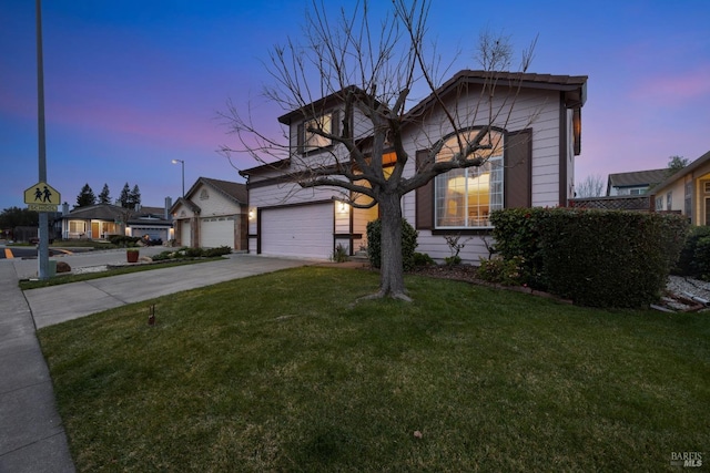 view of front facade with a garage, a lawn, and concrete driveway