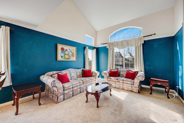 carpeted living area featuring high vaulted ceiling and baseboards