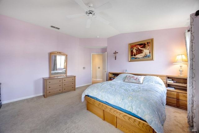 bedroom with ceiling fan, visible vents, baseboards, vaulted ceiling, and carpet