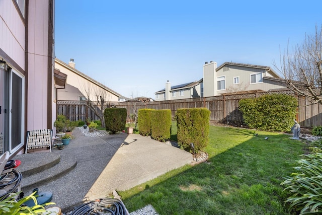 view of yard with a patio and a fenced backyard