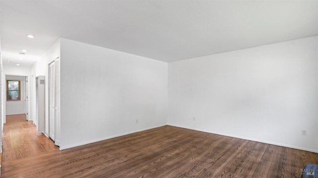 empty room featuring wood-type flooring