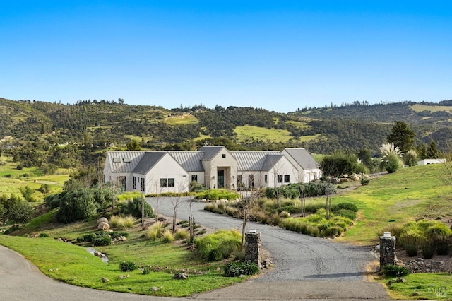 modern farmhouse featuring a mountain view