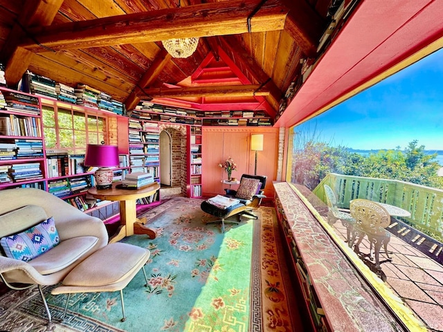 interior space featuring an inviting chandelier, wood ceiling, and lofted ceiling with beams