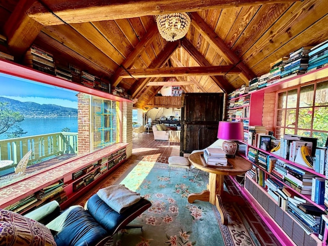 interior space featuring a water and mountain view, wood-type flooring, vaulted ceiling with beams, a chandelier, and wood ceiling