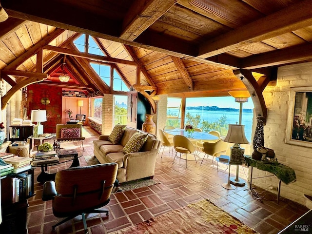 living room with a water and mountain view, vaulted ceiling with beams, and wooden ceiling