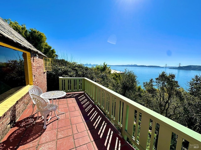 balcony featuring a water view