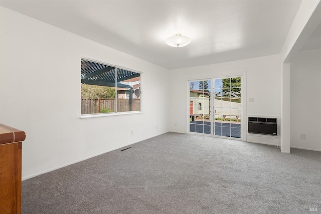 unfurnished living room featuring carpet flooring