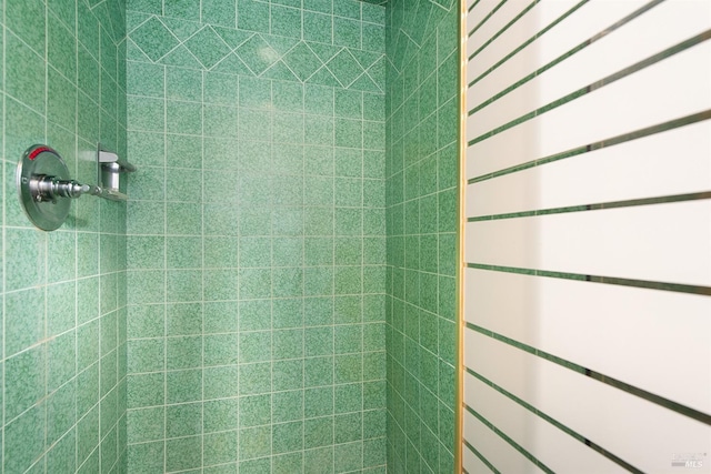 bathroom with tiled shower