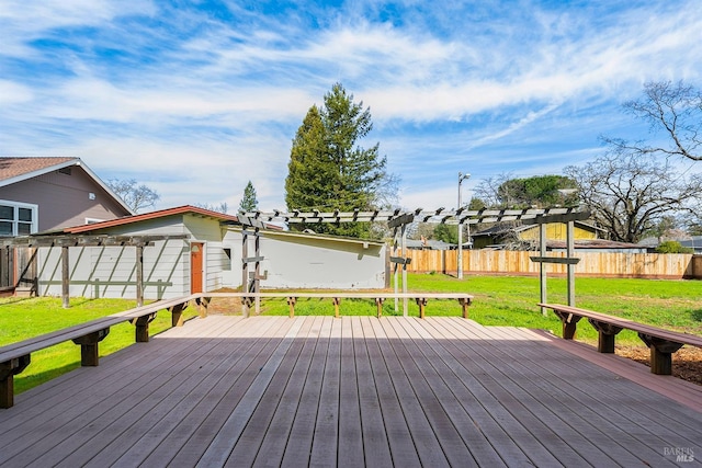 wooden terrace with a lawn and a pergola