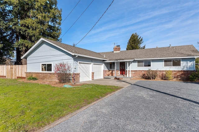 single story home with a garage and a front yard