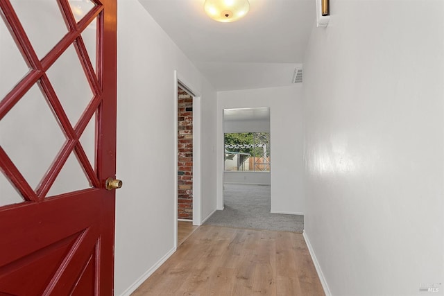 hall with light hardwood / wood-style floors