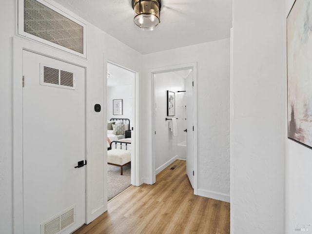 hallway featuring light hardwood / wood-style floors