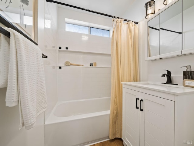 bathroom with shower / bath combo and vanity