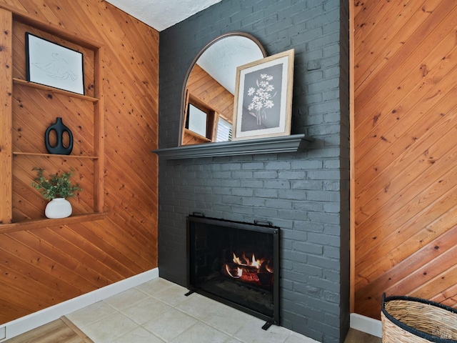 details featuring wooden walls and a fireplace