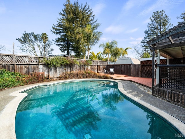 view of pool with a wooden deck