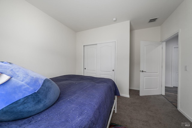 carpeted bedroom featuring a closet