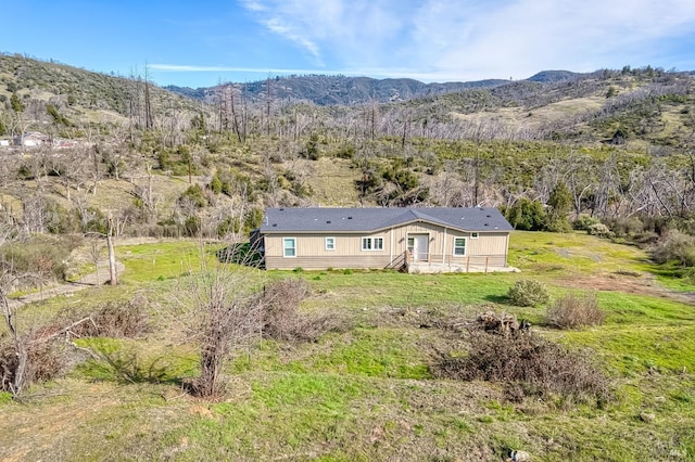 birds eye view of property with a mountain view