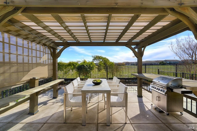 view of patio / terrace featuring a pergola and grilling area