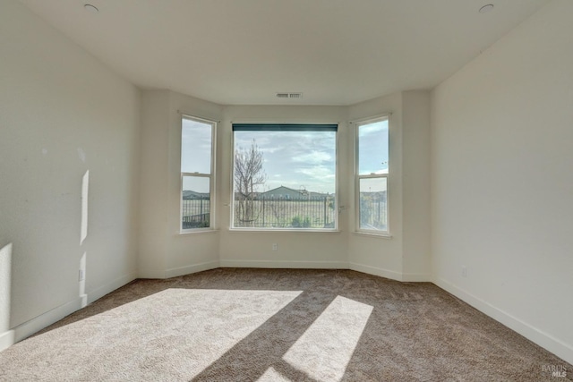 empty room with light colored carpet