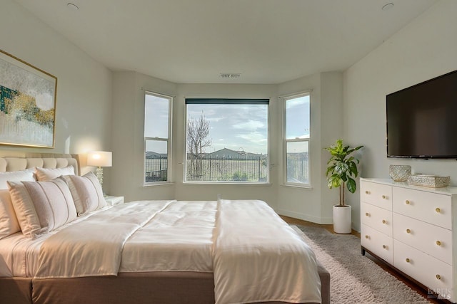 bedroom with light colored carpet