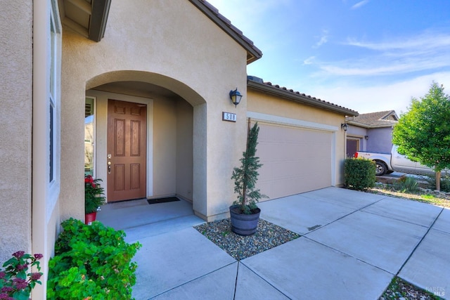 entrance to property featuring a garage